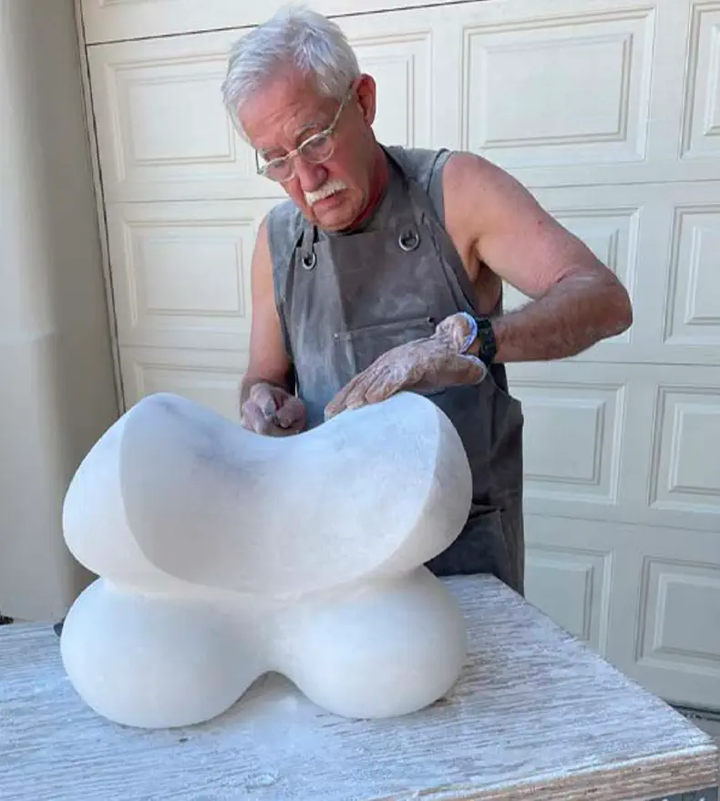 John Clark working on a sculpture in the workshop